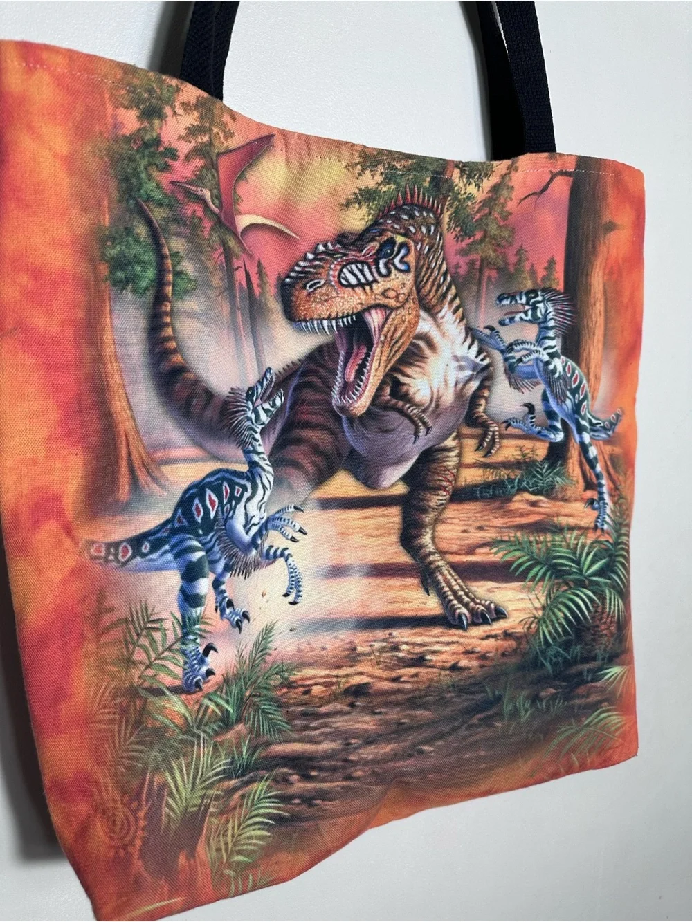The Mountain Orange Dinosaur Messenger Bag with Black Straps